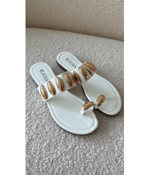 White flip-flops with gold...