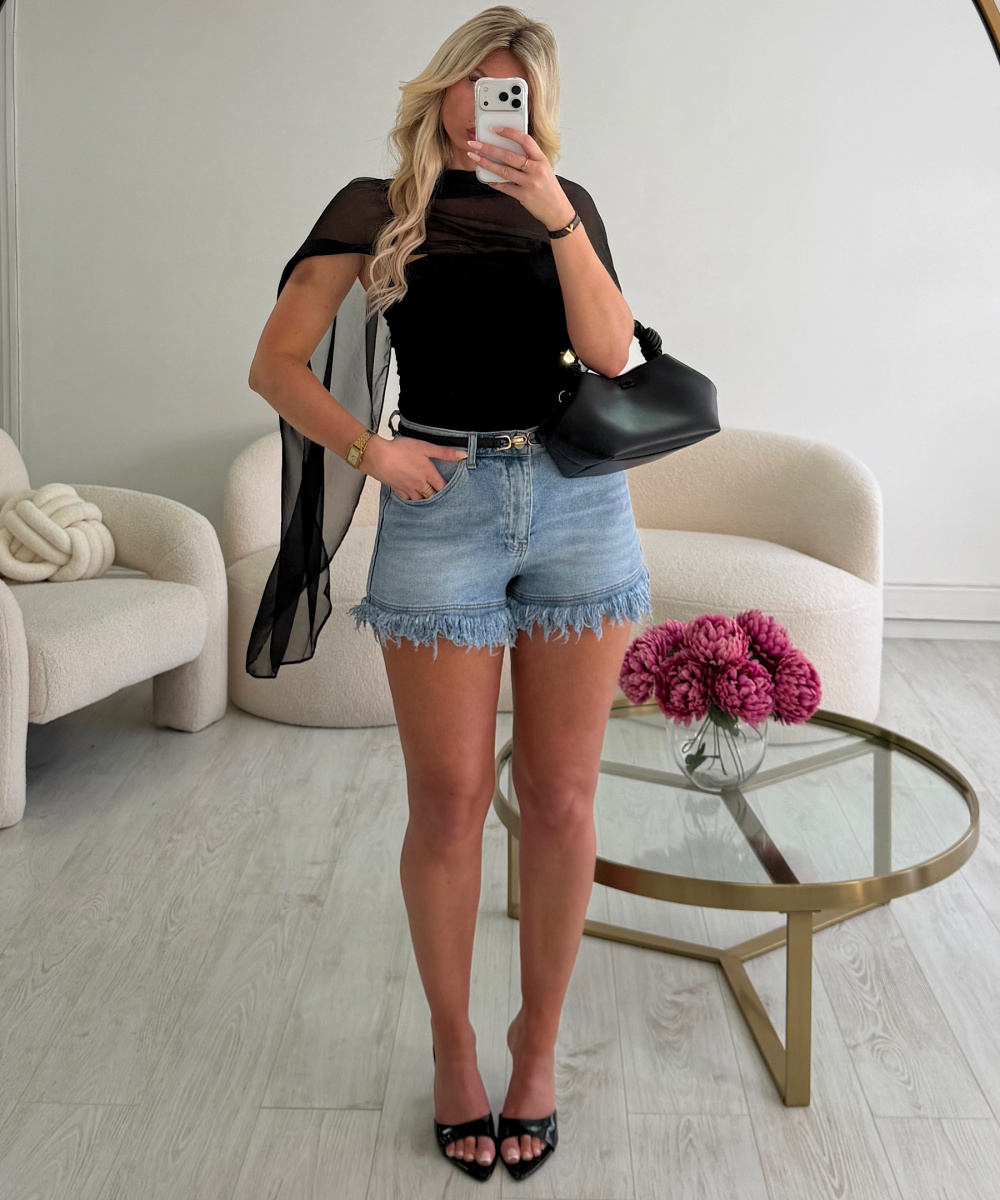 Light blue fringed denim shorts