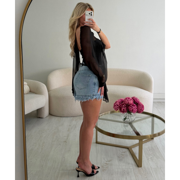 Light blue fringed denim shorts