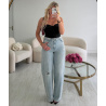 Light blue jeans with rolled-up ripped cuffs