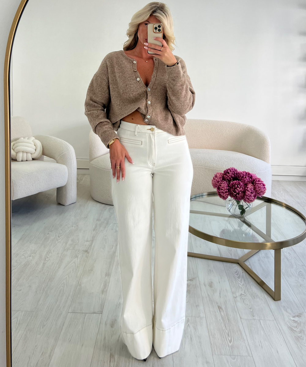tall white jeans with brown stitching