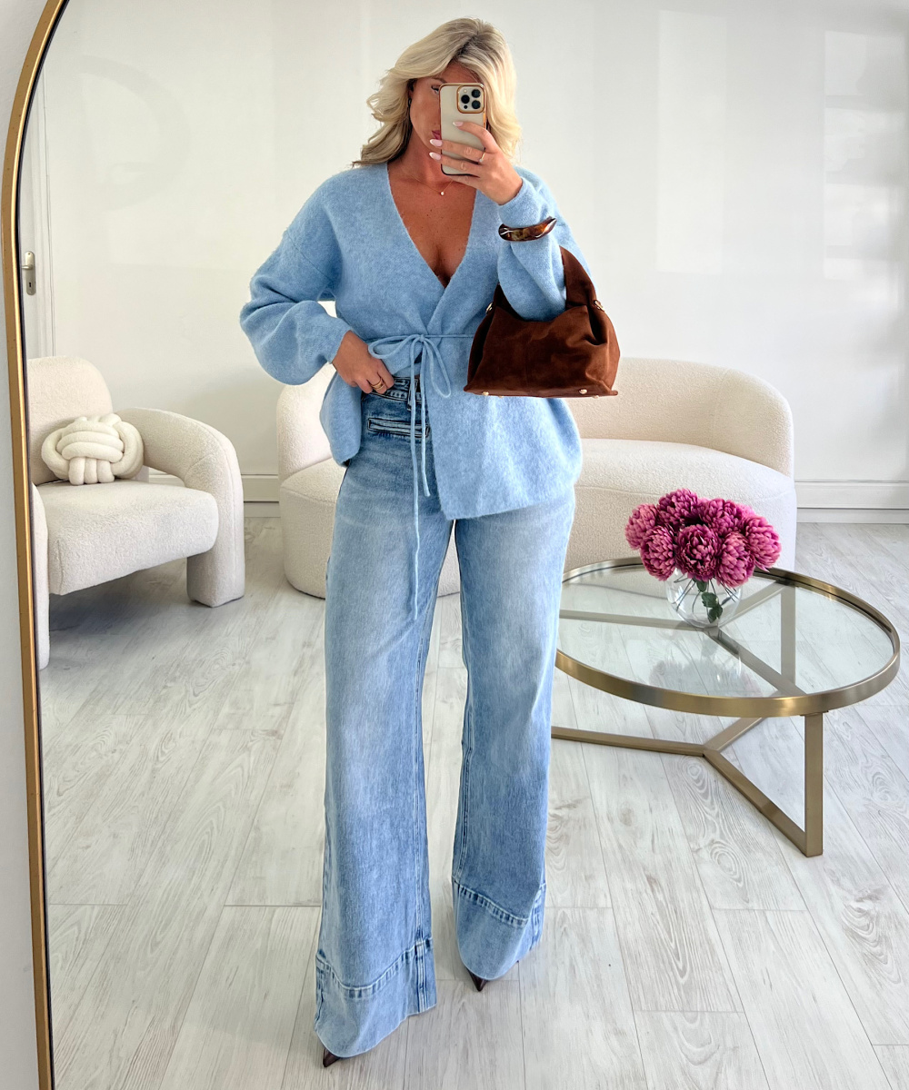 tall blue jeans with stitching