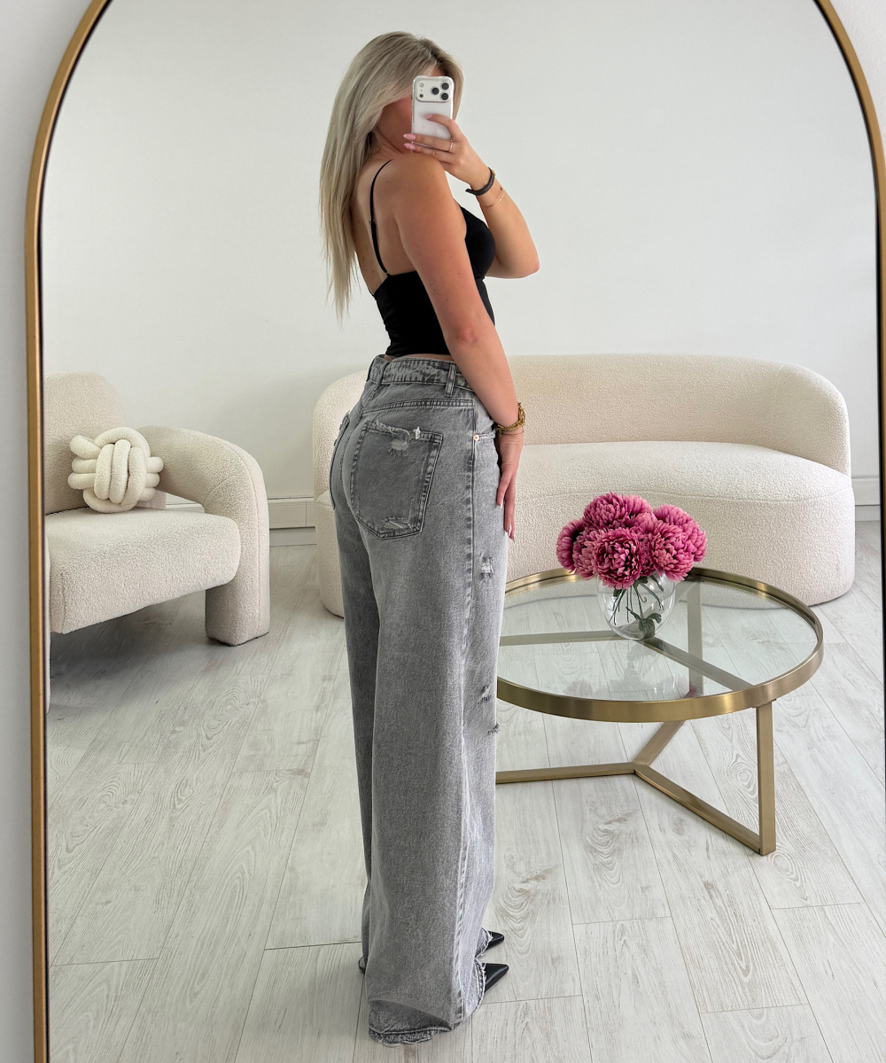 Grey ripped barrel-cut jeans with rolled-up hems