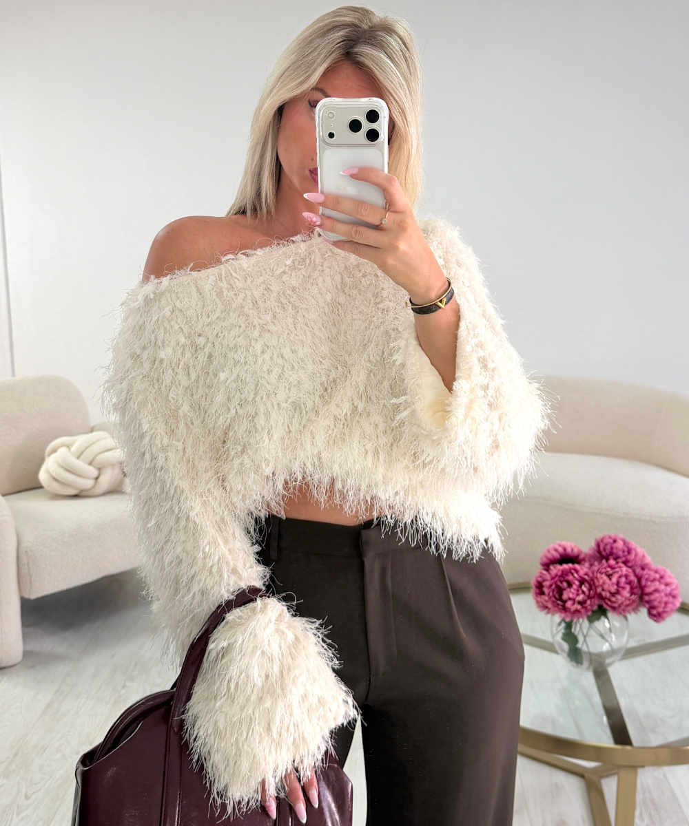 White asymmetric feather top